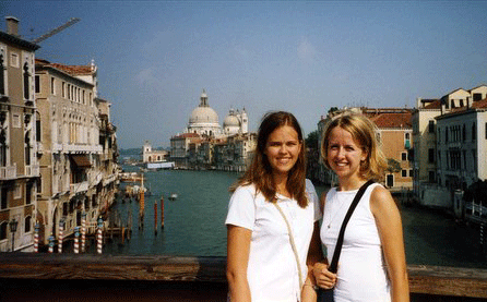 Two students in front of a canal