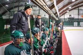 Cooper Hemphill coaching hockey.